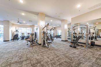 A spacious gym with a variety of equipment
